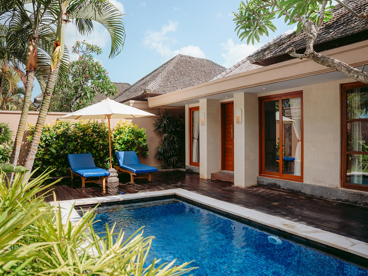 One-bedroom private pool villa with sun loungers and parasol in a tropical garden, The Bidadari