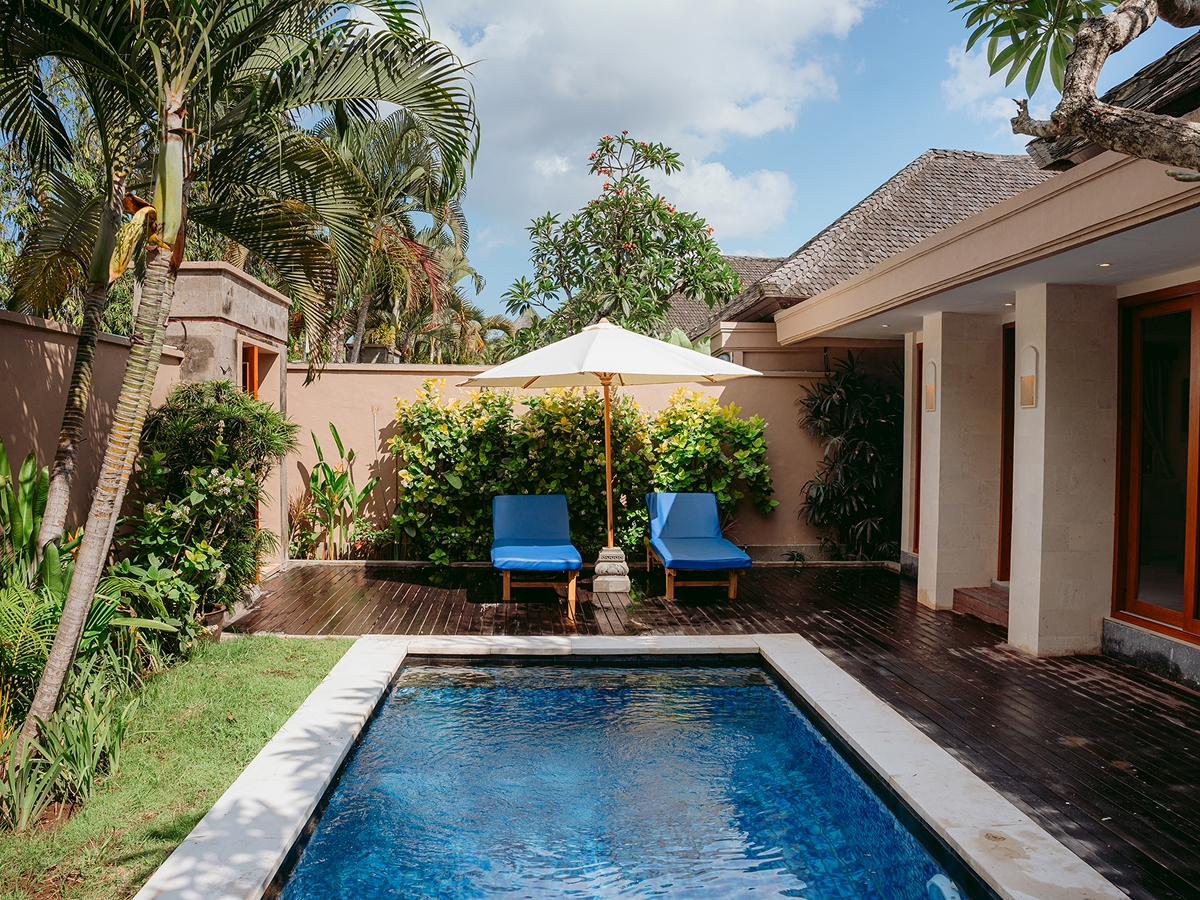 One-bedroom private pool villa with sun loungers and parasol in a tropical garden, The Bidadari