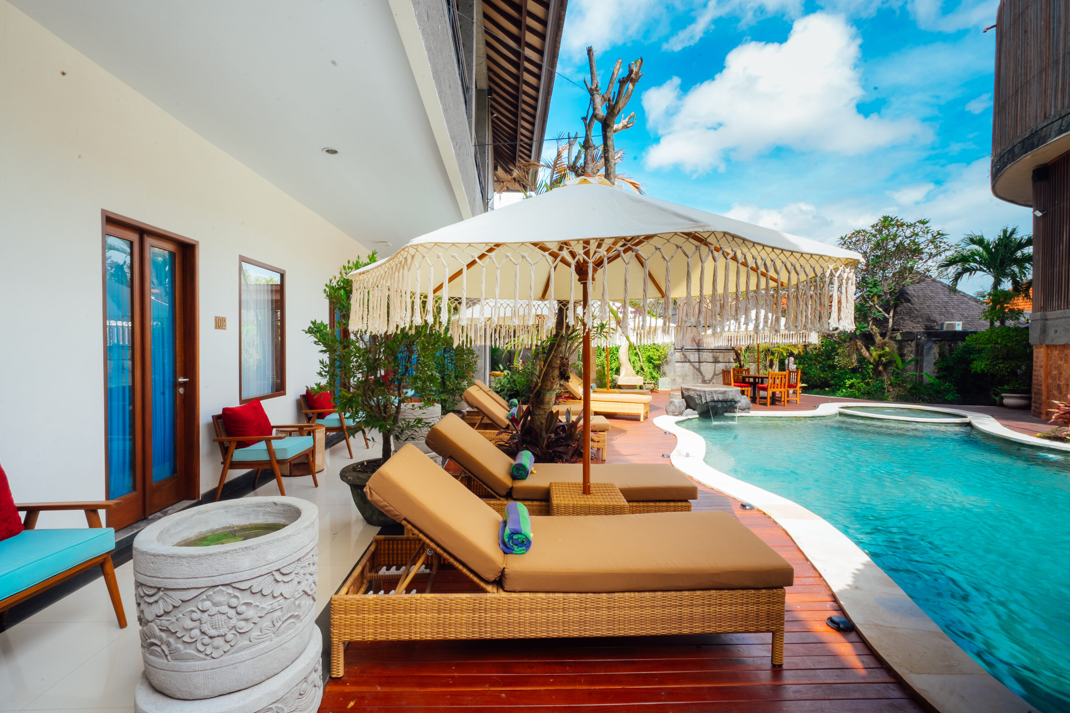 Bright villa living room opening onto a private pool, The Bidadari Villas & Spa