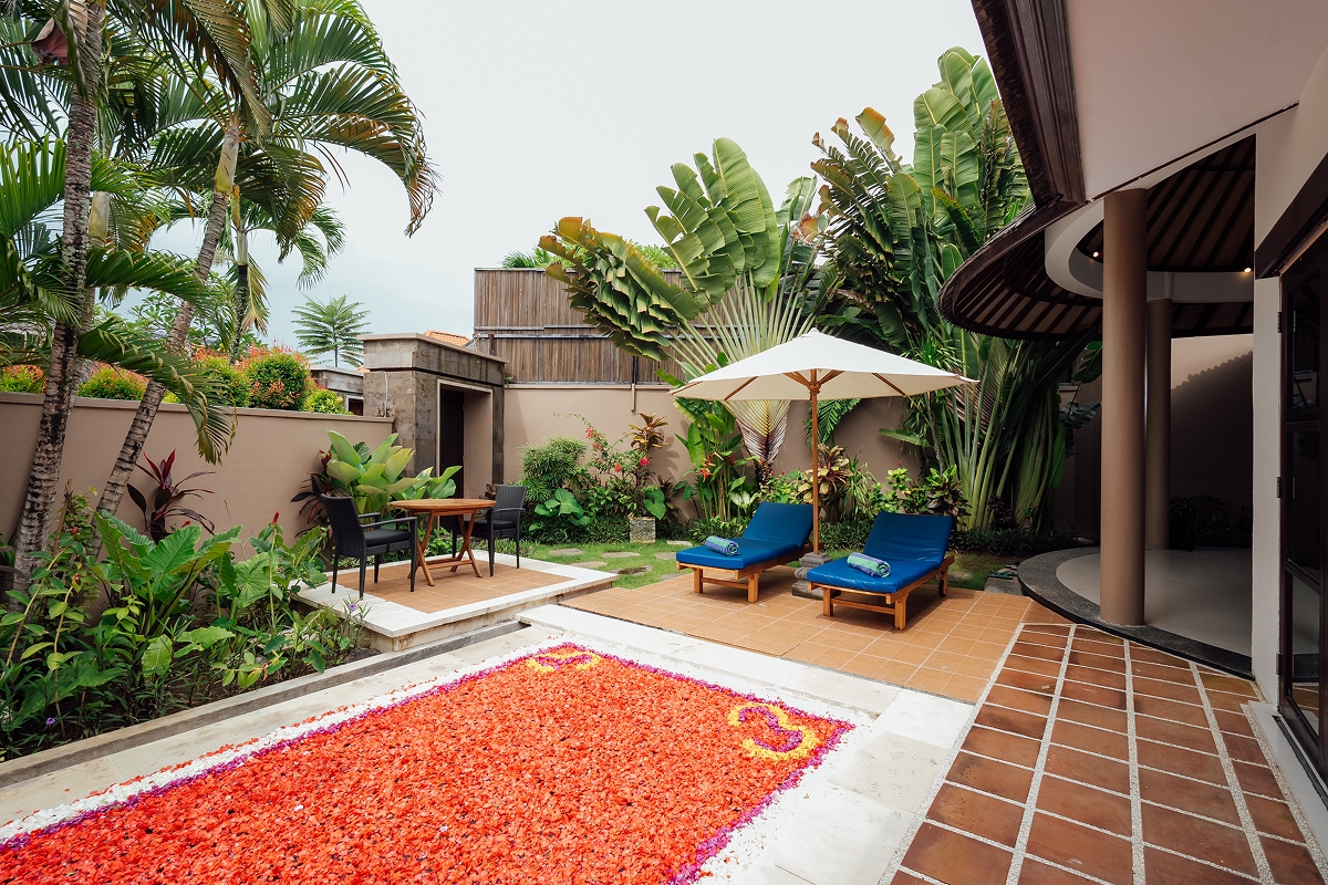Heart of red rose petals on the pool terrace, romantic set-up at The Bidadari