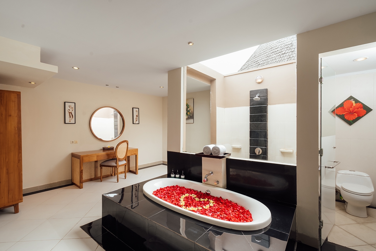 Villa bathroom with freestanding oval bathtub, rose petals and twin vanity, The Bidadari