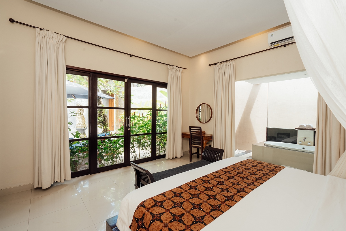 Bright bedroom with king bed and sliding glass doors to the garden, The Bidadari