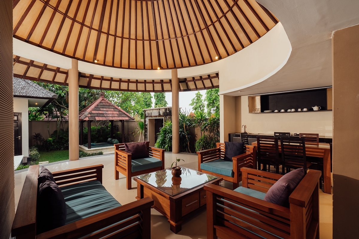 Seating lounge under a circular thatched pavilion, The Bidadari Villas & Spa
