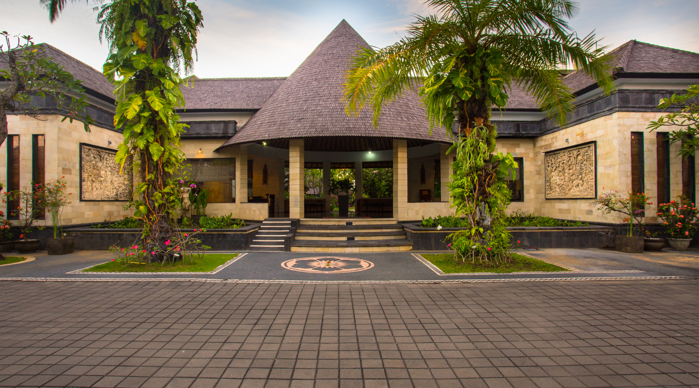 Villa exterior with thatched pavilion, palm trees and a wooden deck path, The Bidadari