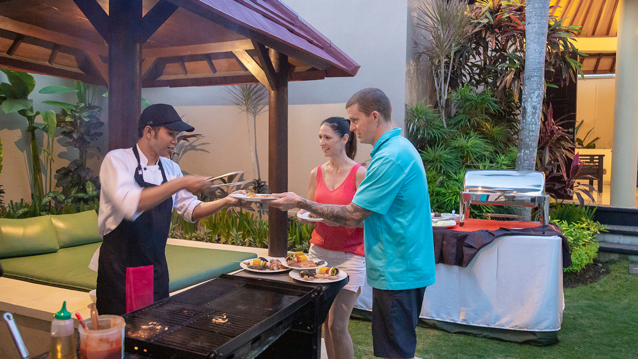 Chef at an outdoor BBQ grill station in the garden, The Bidadari Villas & Spa