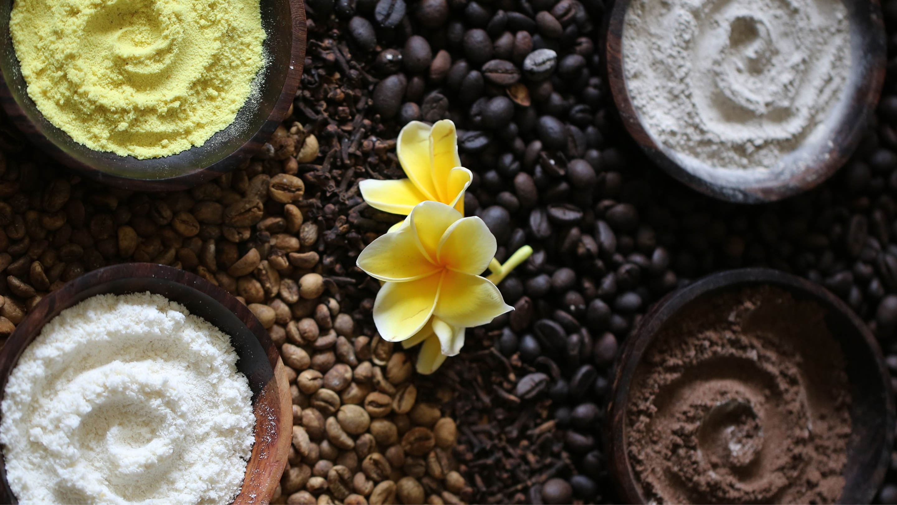 Rolled spa towels with frangipani flowers and coffee beans at Yubi Spa, The Bidadari