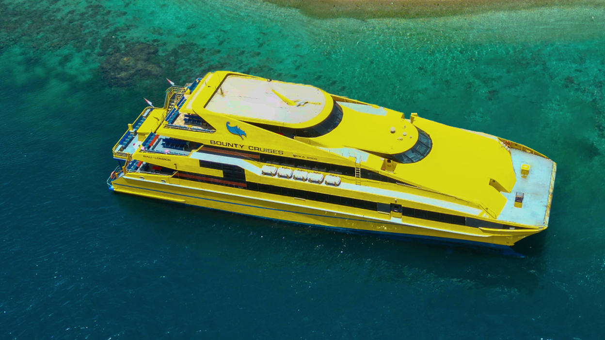 Yellow Bounty Cruise boat on the water for a Bali sunset dinner cruise
