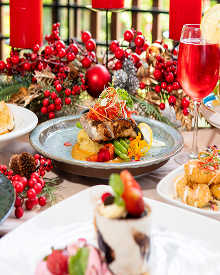 Plated gourmet dish with berries and festive drinks at Yubi Restaurant, The Bidadari