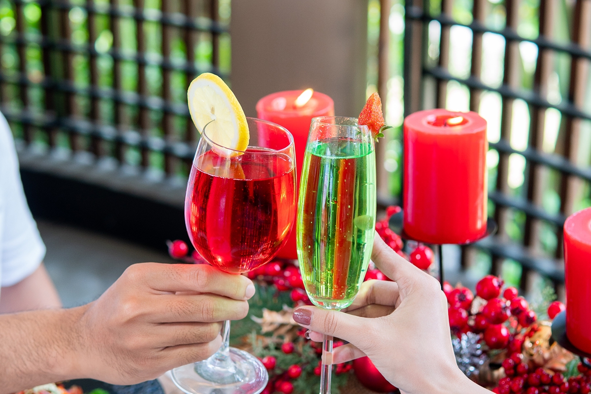 Guests toasting with colourful cocktails at The Bidadari Villas & Spa
