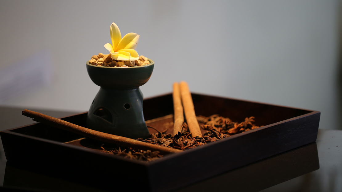 Spa bowl with a lit candle at Yubi Spa, The Bidadari